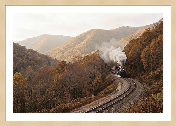 Steam Train Through Autumn Landscape
