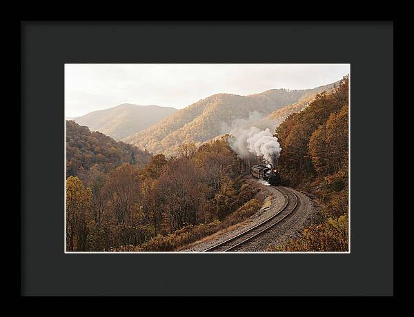 Steam Train Through Autumn Landscape