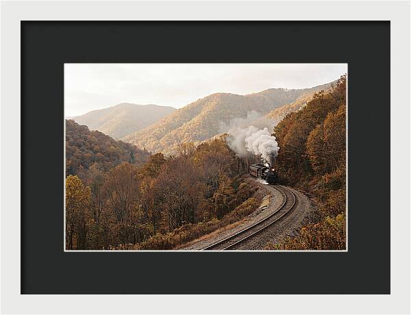 Steam Train Through Autumn Landscape