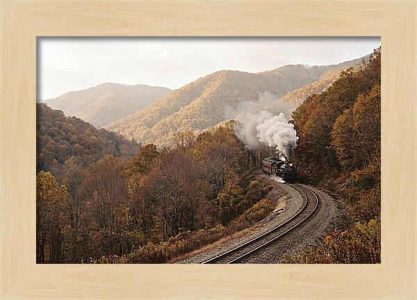 Steam Train Through Autumn Landscape