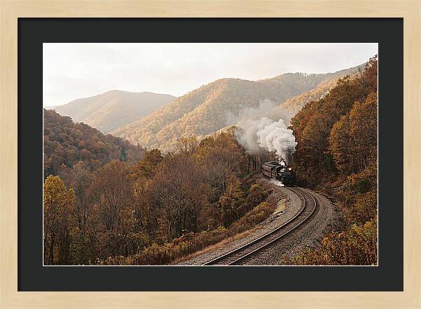 Steam Train Through Autumn Landscape