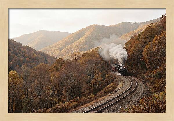 Steam Train Through Autumn Landscape