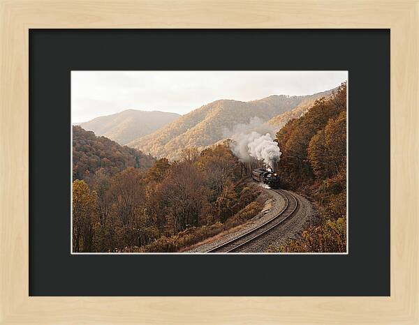 Steam Train Through Autumn Landscape