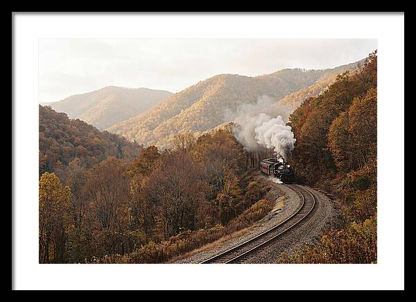 Steam Train Through Autumn Landscape