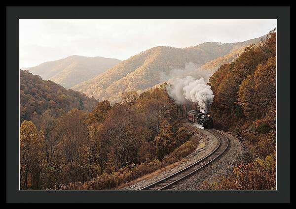 Steam Train Through Autumn Landscape
