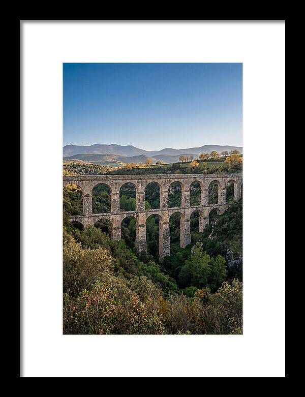 Stone Aqueduct Spanning Deep Green Valley