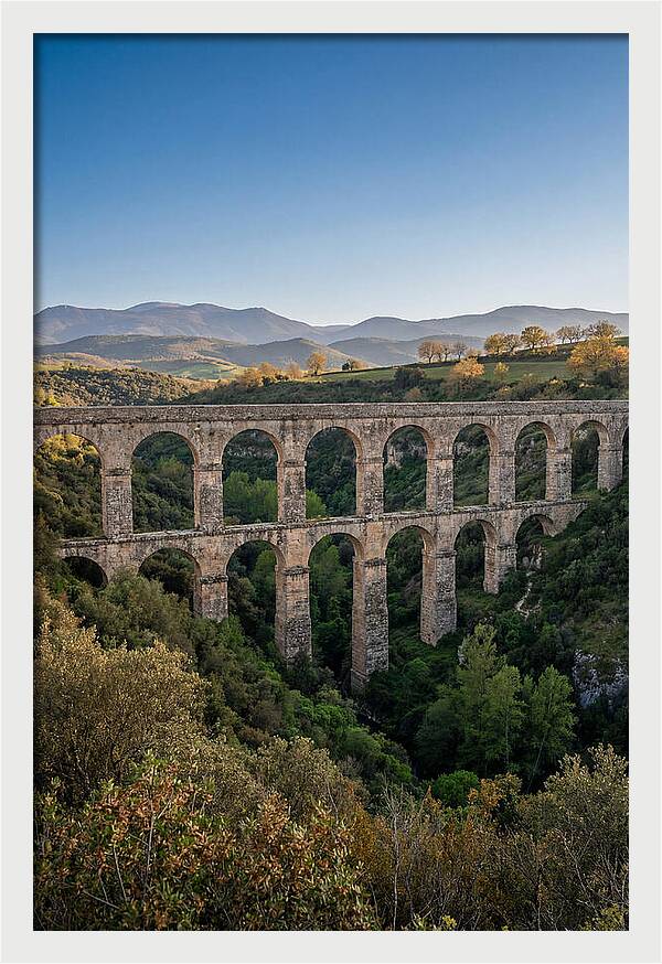 Stone Aqueduct Spanning Deep Green Valley