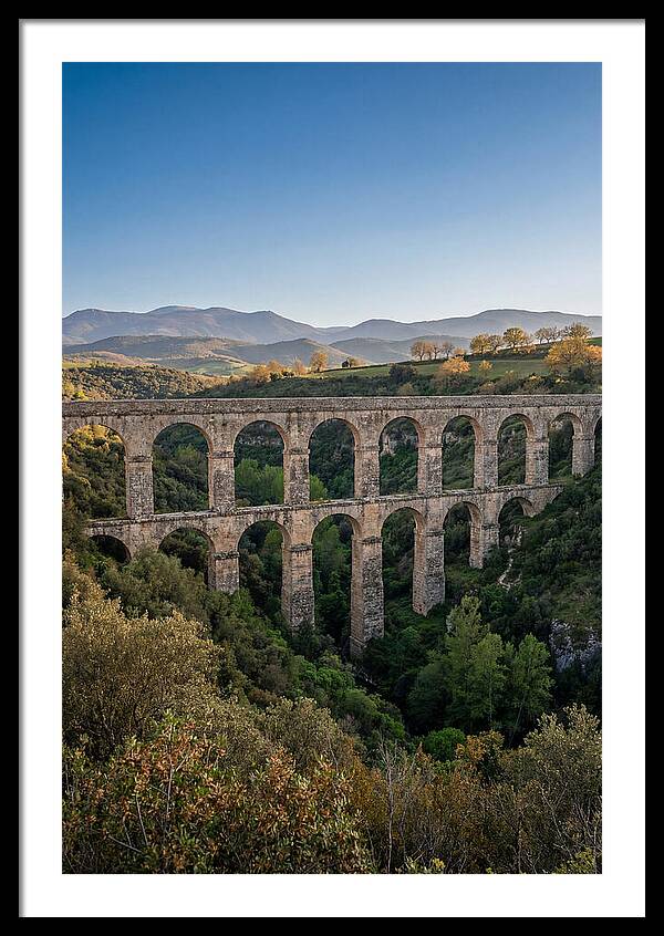 Stone Aqueduct Spanning Deep Green Valley