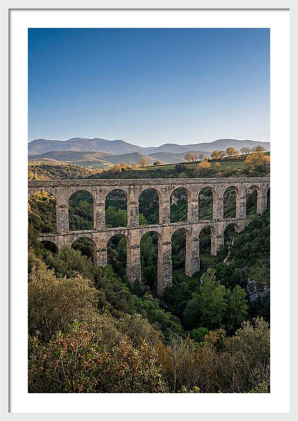 Stone Aqueduct Spanning Deep Green Valley