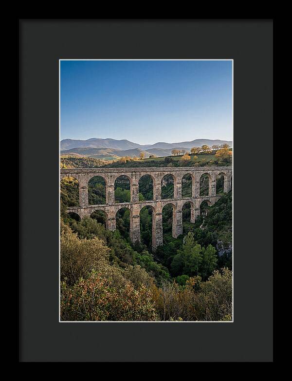 Stone Aqueduct Spanning Deep Green Valley