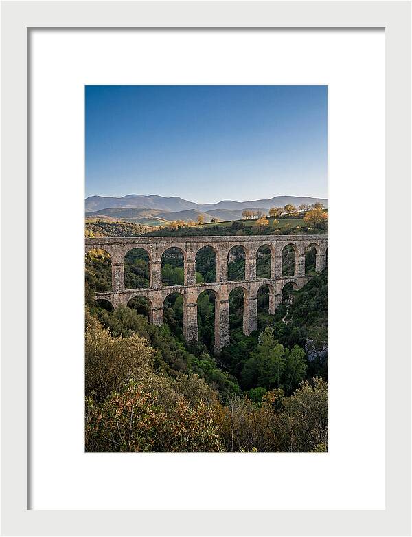Stone Aqueduct Spanning Deep Green Valley