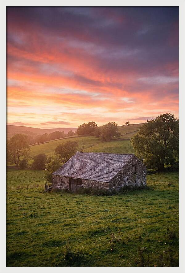 Stone Barn Under Vibrant Skies