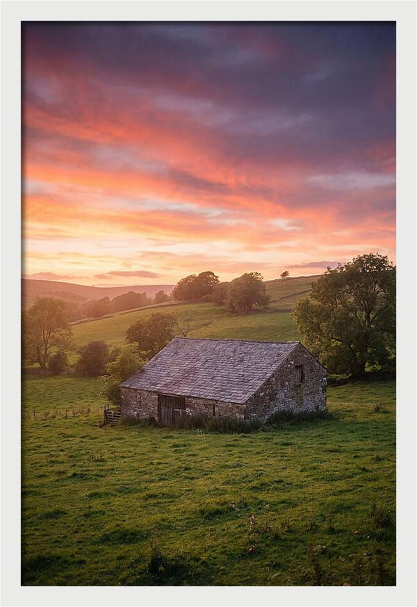Stone Barn Under Vibrant Skies