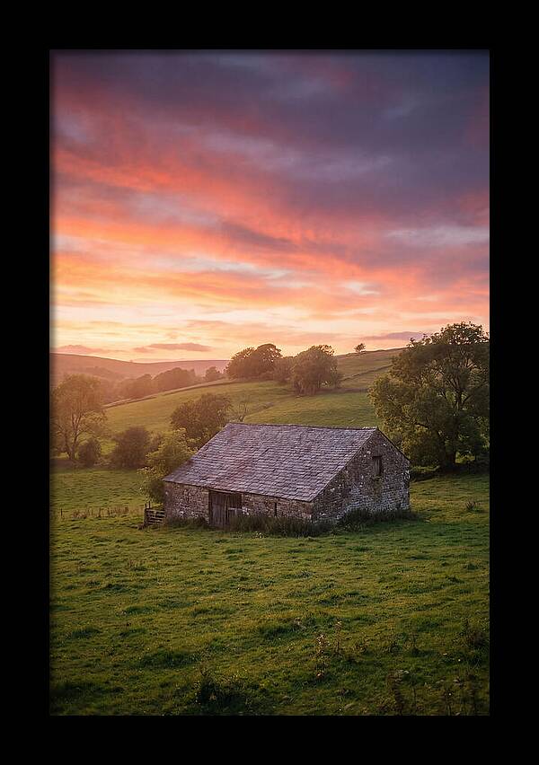 Stone Barn Under Vibrant Skies
