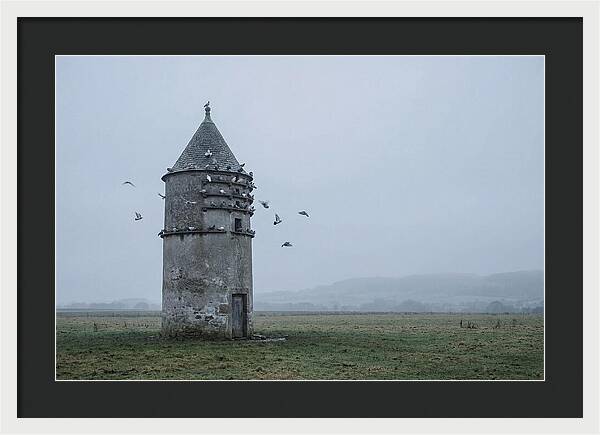 Stone Dovecote Tower In Misty Landscape