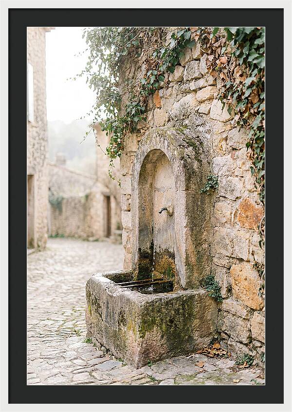 Stone Fountain In Village