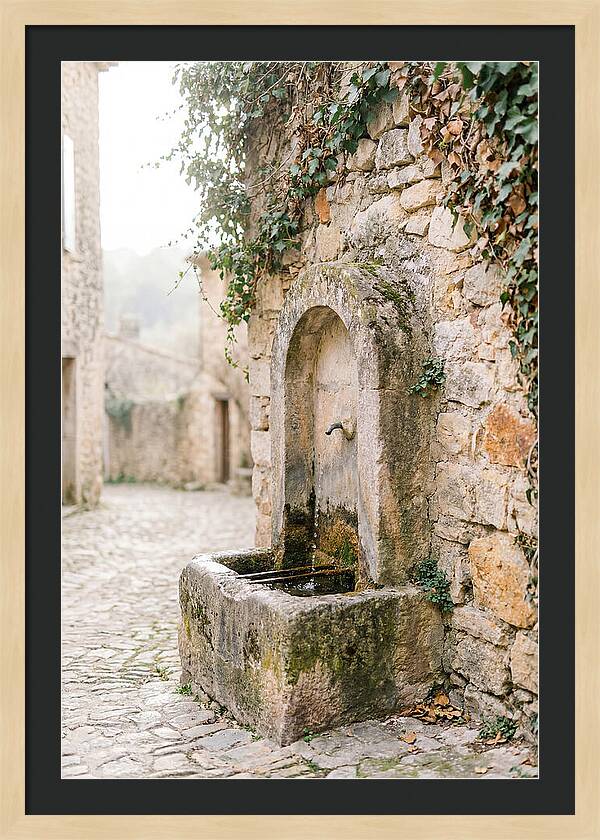Stone Fountain In Village