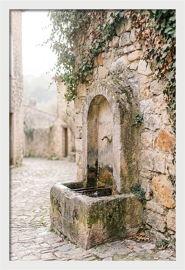 Stone Fountain In Village