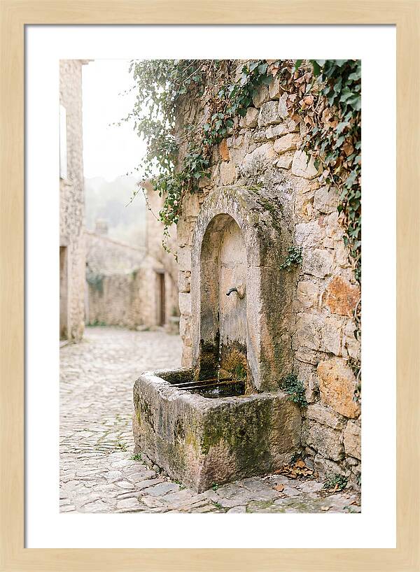 Stone Fountain In Village