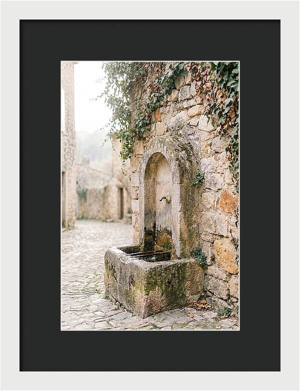 Stone Fountain In Village