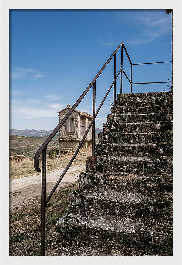 Stone Granary Steps Under Blue Sky