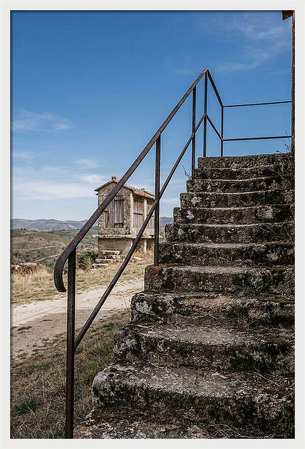 Stone Granary Steps Under Blue Sky