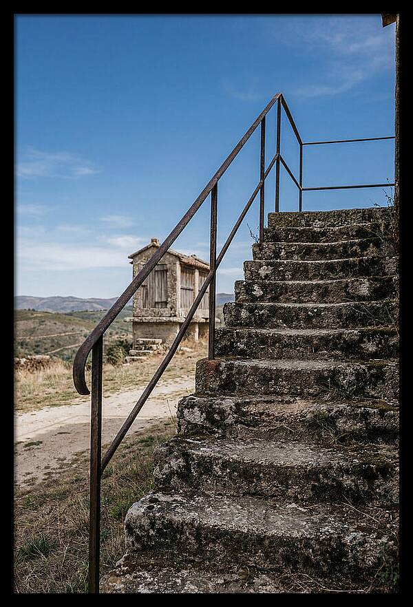 Stone Granary Steps Under Blue Sky