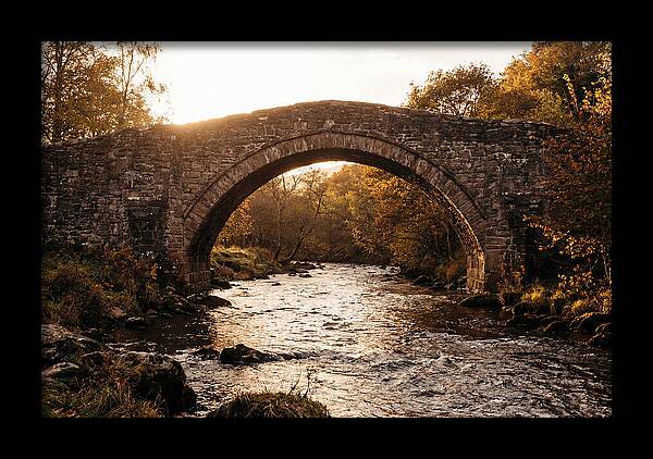 Stone Packhorse Bridge At Sunset