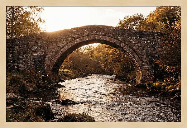 Stone Packhorse Bridge At Sunset