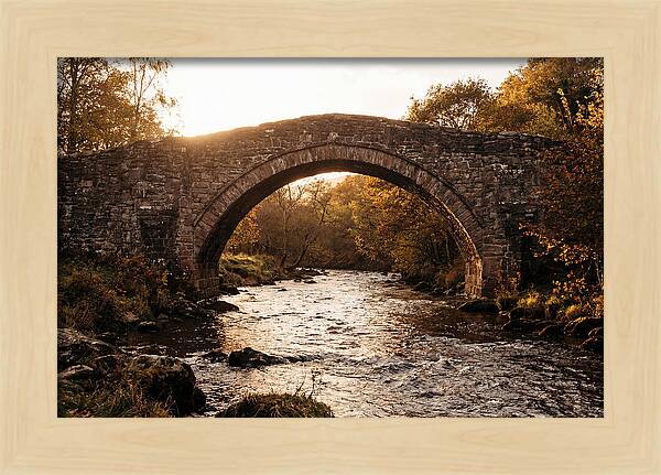 Stone Packhorse Bridge At Sunset