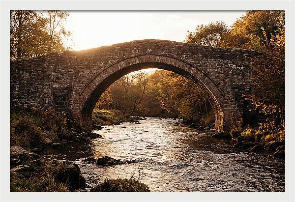 Stone Packhorse Bridge At Sunset