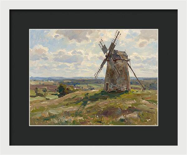 Stone Windmill Under Cloudy Skies