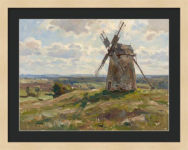 Stone Windmill Under Cloudy Skies