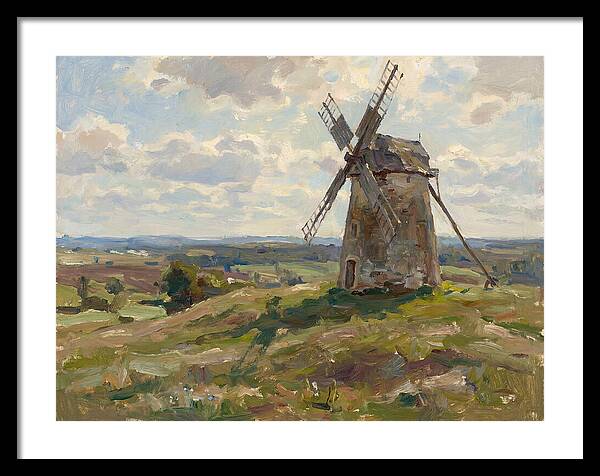 Stone Windmill Under Cloudy Skies