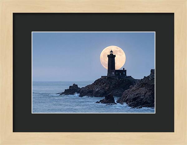 Supermoon Rising Behind Lighthouse