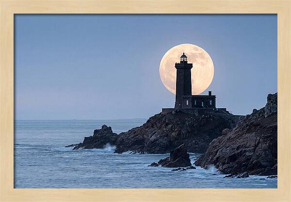 Supermoon Rising Behind Lighthouse