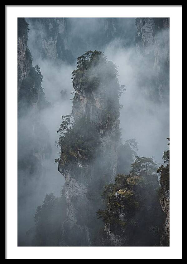 Towering Quartzite Pillars In Fog
