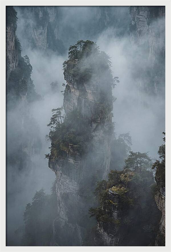 Towering Quartzite Pillars In Fog