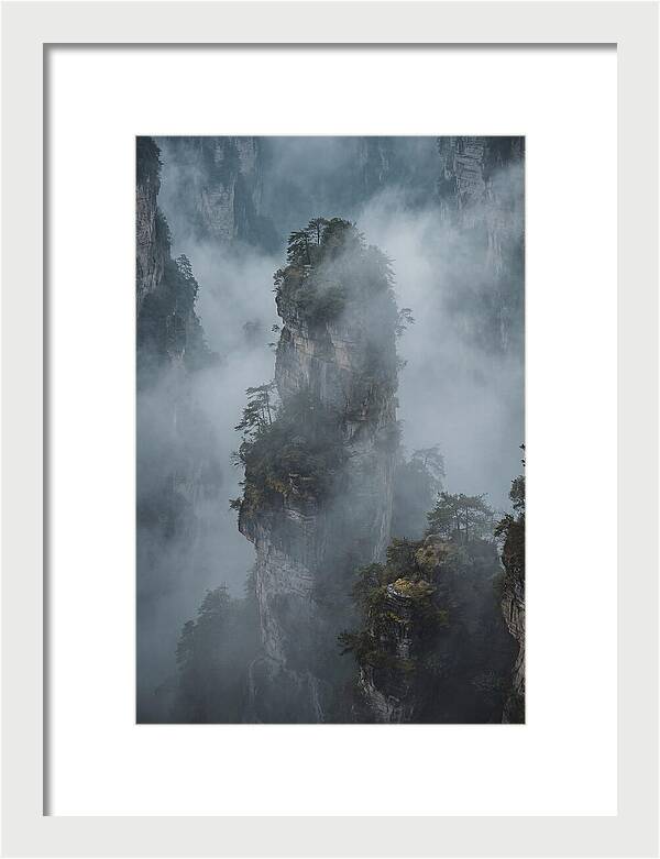 Towering Quartzite Pillars In Fog