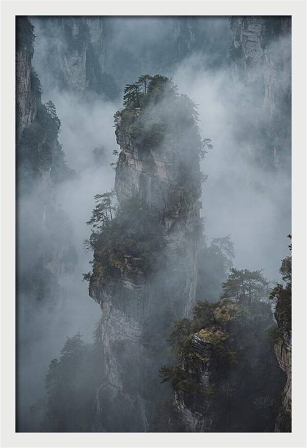 Towering Quartzite Pillars In Fog