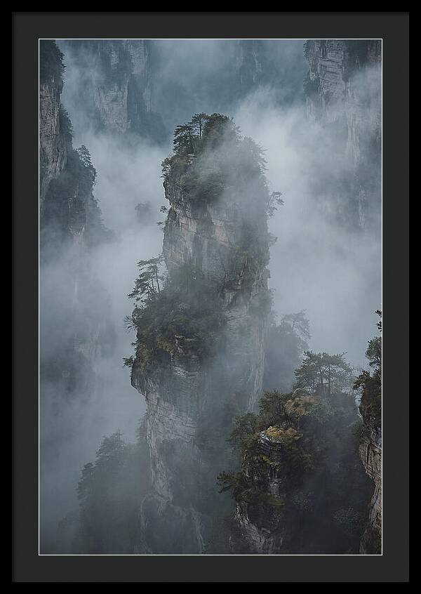 Towering Quartzite Pillars In Fog