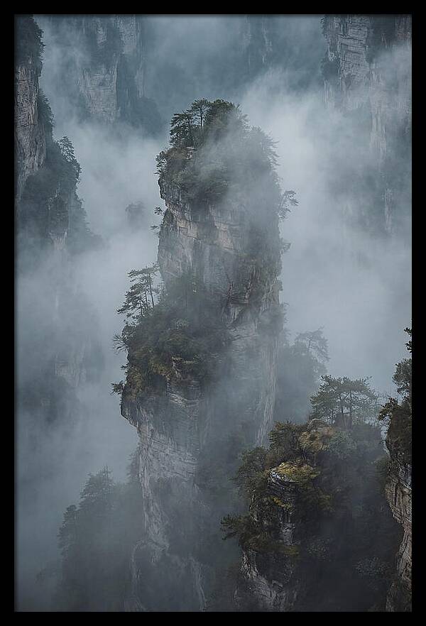 Towering Quartzite Pillars In Fog