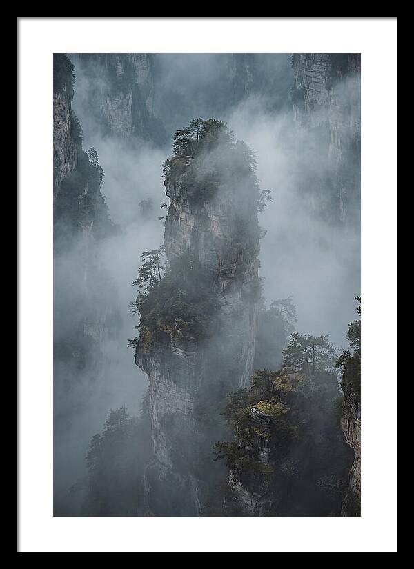 Towering Quartzite Pillars In Fog