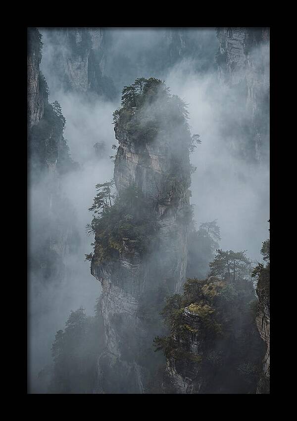 Towering Quartzite Pillars In Fog