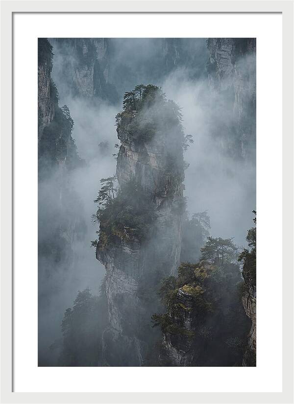 Towering Quartzite Pillars In Fog
