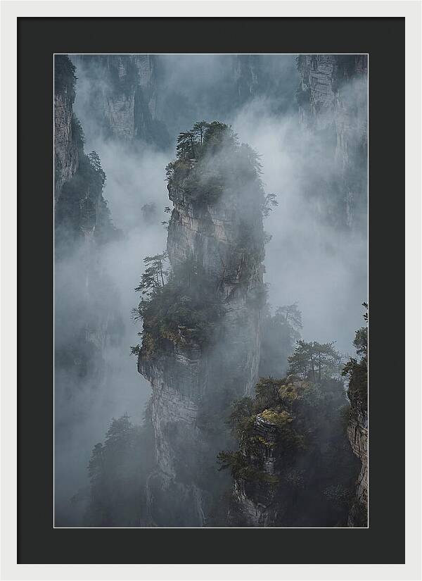 Towering Quartzite Pillars In Fog