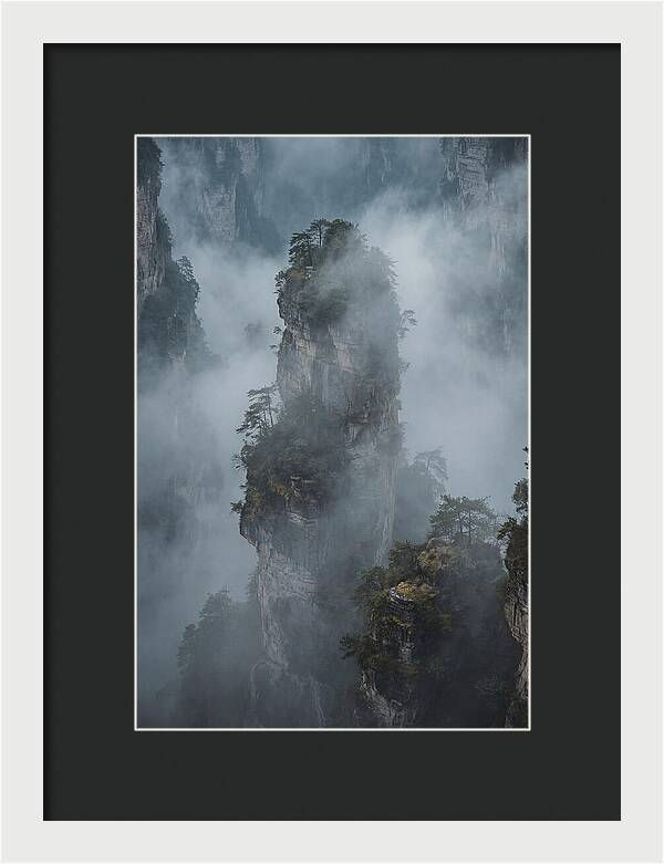 Towering Quartzite Pillars In Fog