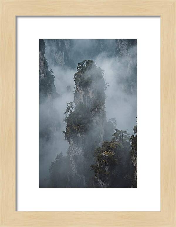 Towering Quartzite Pillars In Fog
