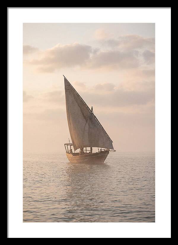 Traditional Dhow Sailing Into The Horizon