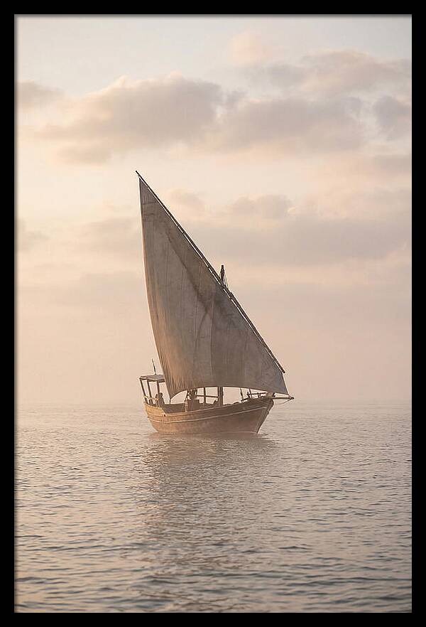 Traditional Dhow Sailing Into The Horizon